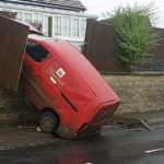 a postal van crashed into a wall