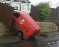 a postal van crashed into a wall