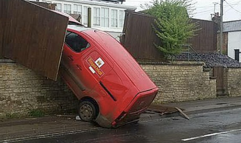 a postal van crashed into a wall
